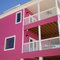 Pink House on beach, love these southern colours