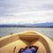 Heading back to LAE from SALAMAUA in Banana Boat to VOCO Point on right in front of  Mount Lunaman, on left is Lae Whalf and Cement Factory in HUON GULF,  in MOROBE Province  PNG