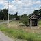 There are few of these old little latticed sheds left.  Farmers used to place their large cans of milk in them for pick up. They provided shade and a breeze at the same time.