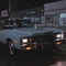 Cindy casually drives off after blowing up a police paddy wagon