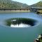 LAKE HOLE 70 FEET WIDE -- Drain Pipe Depth 280 ft (86m) & Length over 700 ft - Lake Level has been 6 feet (2 meters) above edge of Drain Spillway.  May 2006 was last time water went over edge of Drain due to low rainfall - Photo Lake Level 0.89 feet over edge - Click photo for Full Effect 1600x1200... Taken@ Lake Berryessa, Napa, California
