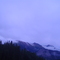 Clouds creep over the Rockies