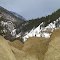 Contrasting Brown Badlands Below With Green And White Mountainside In Sinclair Canyon Near Radium Hot Springs BC Mar '12