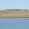 Contrasting Blue Waters And brown Prairie In The Claybank Hills Near Claybank SK May '12