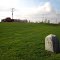 Original mile stone dated 1837. One side has K XVII meaning 17 miles to Kingston, the other side has N VI meaning 6 miles to Napanee.
