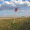 Stop sign by the three silos.