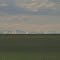Vast, Green Prairie And Distant Snowy Summits As Seen From West of Innisfail AB May '13