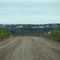2010-06-27 Approaching the Mackenzie River from the north.  Looking across the river to the Village of Tsiigehtchic.