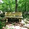 Bench Provided for Rest and Viewing Old Stone Bridge