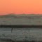 Wonderful Mountains Contrasting With Orange Sunset Skies And White, Snowy Prairie Near Bowden AB Mar '13