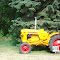 tractor sitting besides the Boyne River
