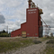 Wooden grain elevator and abandoned rails at Glaslyn, SK
