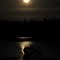 supermoon and a fisherman's boat