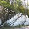Interesting black and white rock, highly metamorphosed.  The streaking is from compressing the rock when just below the molten state, not from intrusions.