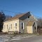 A Methodist Episcopal Church 1861.   Now a private residence.  Note the sattelite dish, just behind the hand operated water pump.   Such contrasts are common in this area.
