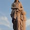 woman atop gravestone, life-size, Woodlawn Cemetery, Independence, MO
