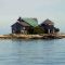 A lonely house in the middle of the ocean