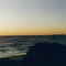 Sunset on the Deleware Bay with Cape May Point Lighthouse on far right.
