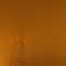 Vanishing Microwave Tower on a Foggy Night