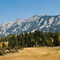 Steep, untouched mountain range between two big coal pit mines