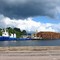 Loading wood onto barge