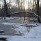 Sunrise over seasonal frozen water pond