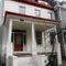 Pleasantly Restored Colonial Revival Row House with New Abstracted Iron Grills