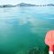 Paddling Canoe  in Fairfax Harbour  near Ship Wrecks, with Port Moresby in background, PNG, Photo by Paul Barker, on 22-01-2012