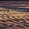 Sky reflection on the beach.