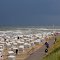 Ein Regensturm zieht nach Osten ab, und am Strand von Wangerooge scheint schon wieder die Sonne/A Rainstorm Is Moving Eastward, And The Sun Is Shining Again At The Beach Of Wangerooge