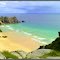 Porthcurno, Logan Rock and Pednvounder Beach, rain at sea