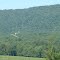 Plane Flying Down for a Refill after Spraying Power Line