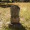 A grave in a secluded cemetery