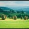 Panorama Tatr Wysokich spośród snopów siana Beskidu Wyspowego - The High Tatras panorama seen beyond the sheaves of hay in Beskids Mountains
