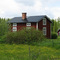 Stuga i sommarskrud.