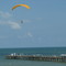 Parachuter over pier