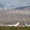Planes (747s, DC-10s etc.) waiting for their fate (foreback - Mojave Air and Space Port - MHV) and windmills (background) - Mojave, CA, USA.
