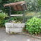 Old water well in disfunction on main road of Sous-Parsat, Creuse, France