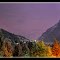 Stormy night light on the road of the pass of the Aravis.