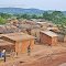A small village of mud-brick houses next to the main road to Matadi.