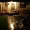 Home. In the rain. At night.
