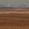 Contrasting Snow Capped Mountain And Vast, Barren Prairie West Of Milk River AB Sep '12