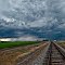 Railroad tracks leading into the storm