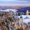 Blue Mountain summit firetower with Blue Mountain Lake and mountain sunrise shadow behind