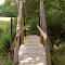 FLT M10 7.6 mi - Bridge, 18' long, 6x6 stringers, 2x10x42 deck, 2x6 hand rails, 6x6 upper posts