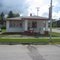 Old gas station with lace curtains