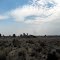 A dust devil at crack in the ground approach trail