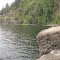 Cement footings from the 1887 Elk Rock train trestle, railroad cut in the distance