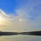 Small rainbow above St Marys Lake in a sunny day