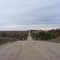 Hilly prairie road, looking east
